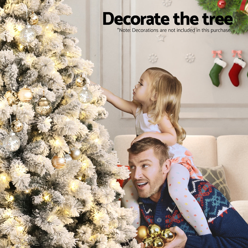 2.1m Snow-Flocked Pre-Lit Christmas Tree – 500 Warm White LEDs